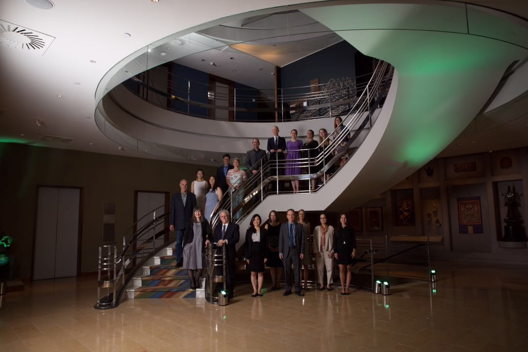The Veris team stands on a staircase in the Rubin Museum in NYC in 2017.